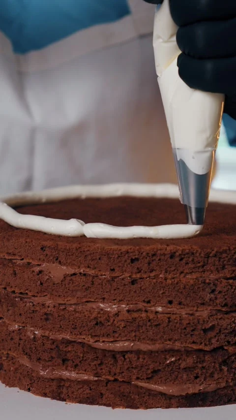 Process of making chocolate cake with white cream Stock Footage 322549956