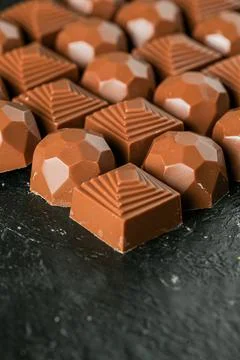 Process of making chocolate candies with various shapes and designs Stock Photos