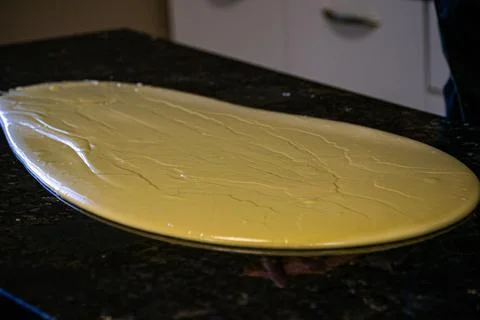 The process of making chocolate in a chocolate studio. Bitter chocolate with  Stock Photos