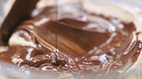 Process of making chocolate ice cream. Mixing ingredients in glass bowl. Stock Footage 150885236
