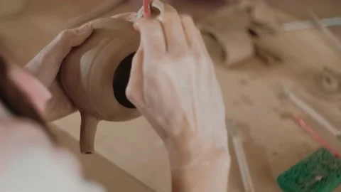 The process of making clay item in the workshop. Decorative tableware made of Stock-Footage 152335517