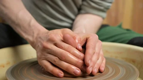Process of making a clay pot by a potter, close-up. A potter creates a clay pot Stock Footage 154141371