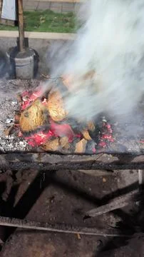 The process of making coals for grilled fish, made from old coconut shells Stock Photos