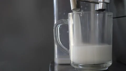 Process of making coffee by coffee machine into glass transparent cup, latte Stock Footage 139554245