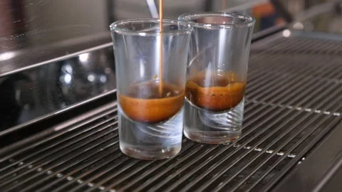 Process of making coffee by coffee machine into glass transparent cup, espresso Stock Footage 144064274