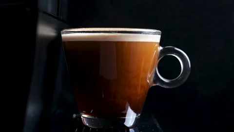 Process of making coffee by coffee machine into glass transparent cup Stock-Footage 148122433