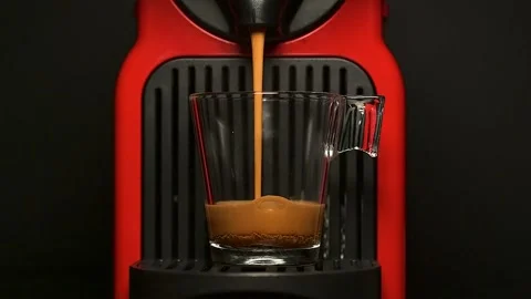 Process of making coffee by coffee machine into glass cup, Stock Footage 177079097