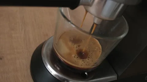 Process of making coffee by coffee machine into glass Stock Footage 196847725