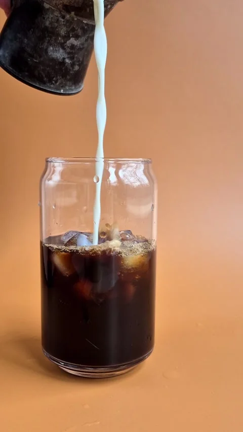 Process of making coffee with milk and ice. Ice latte Video stock 304665990