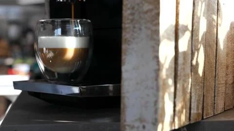 Process of making coffee with milk on a professional coffee machine Stock Footage 149527963
