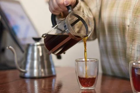 The process of making coffee, a natural coffee drink is filtered through a Stock Photos