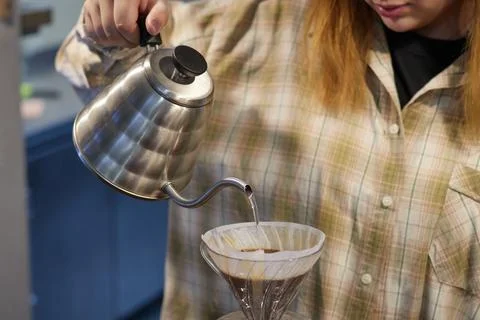 The process of making coffee, a natural coffee drink is filtered through a Stock Photos