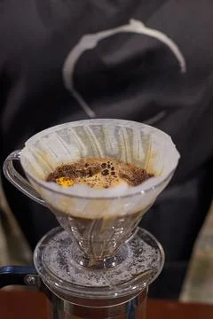 The process of making coffee, a natural coffee drink is filtered through a Stock Photos