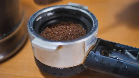 The process of making coffee, picking up coffee, tamping coffee footage video 4k Stock Footage 128195264