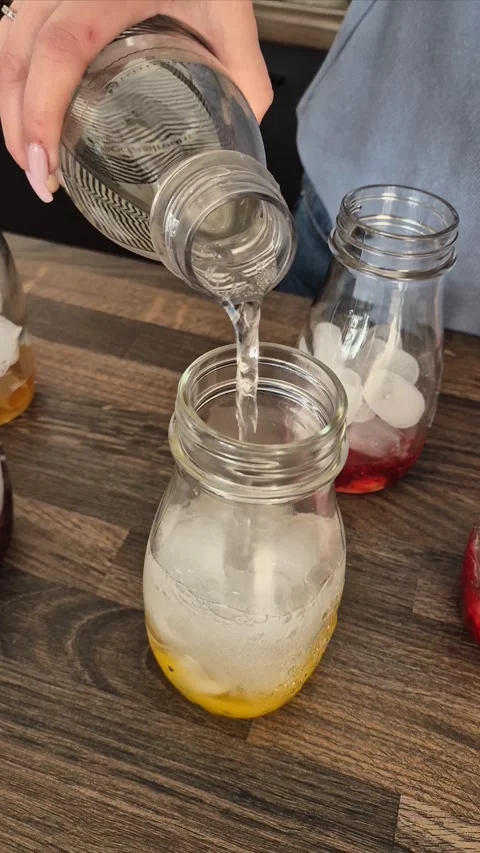 Process of making cold fruit lemonade with mango. Barista prepares cold, refr Stock Footage 304740960
