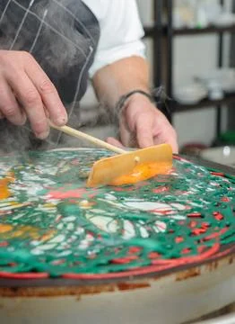 The process of making colored openwork pancakes from several layers of colored Stock Photos
