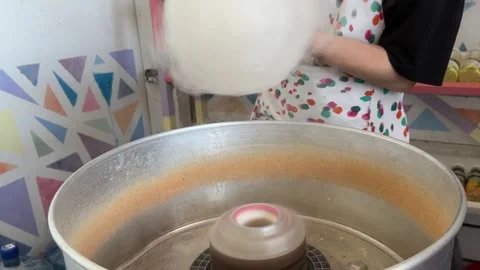 The process of making cotton candy. The apparatus with white sugar 스톡 동영상 244326642