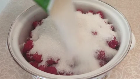 The process of making crushed raspberries with sugar. Stock Footage 313807035