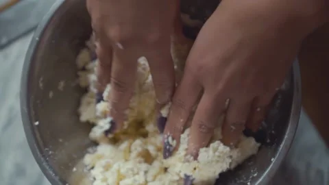 The process of making curd cheesecakes with bananas. The woman's hands mix the Stock Footage 138462846