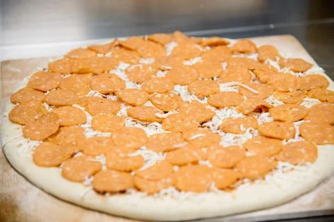 Process of making, decorating, preparing pizza. Close up Stock Photos