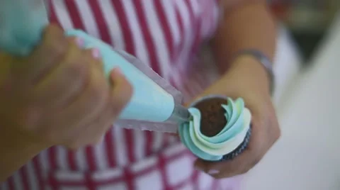 Process of making delicious cupcakes in a bakery shop Stock Footage 57531339