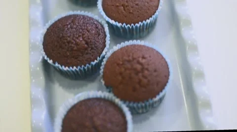 Process of making delicious cupcakes in a bakery shop Stock Footage 57531360
