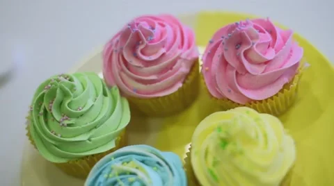 Process of making delicious cupcakes in a bakery shop Stock Footage 57531460
