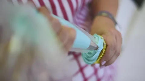 Process of making delicious cupcakes in a bakery shop Stock Footage 57531464