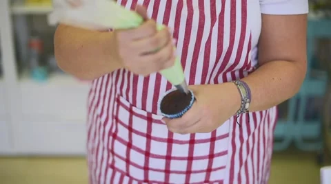 Process of making delicious cupcakes in a bakery shop Stock Footage 57531467