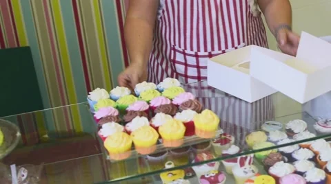 Process of making delicious cupcakes in a bakery shop Stock Footage 57531673