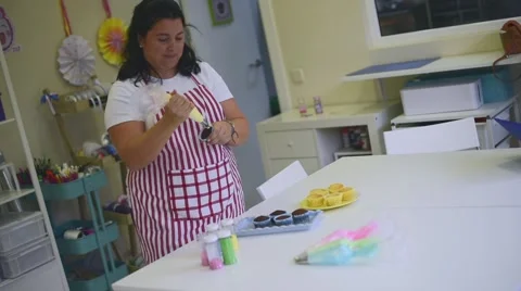 Process of making delicious cupcakes in a bakery shop Stock Footage 57533230