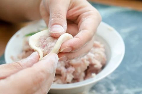 The process of making delicious home-made dumplings with meat. Stock Photos