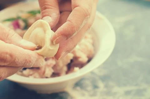 The process of making delicious home-made dumplings with meat. Stock Photos