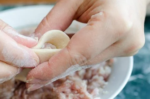 The process of making delicious home-made dumplings with meat. Stock Photos