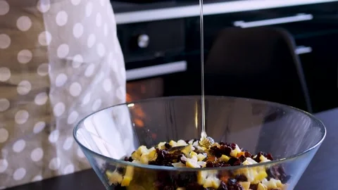The process of making dessert, add honey to a dish with sliced fruit, Stock Footage 226364602