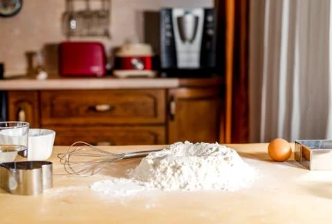 The process of making dough, flour and eggs on the table Stock Photos