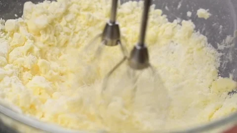 Process of making dough. Mixing ingredients with kitchen mixer in glass bowl. Stock Footage 153457186