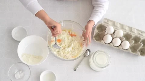 Process of making dough. Small child's hands mix flour and eggs in bowl. Stock Footage 178526691