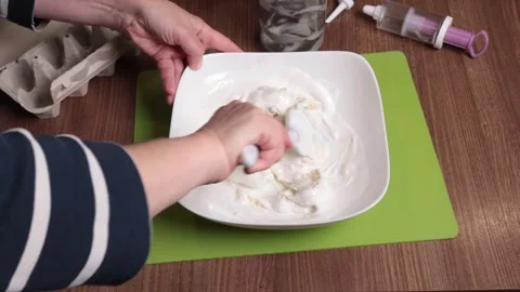 Process of making dough. Woman mixed powdered sugar, almond flour and egg white Stock Footage 287421959