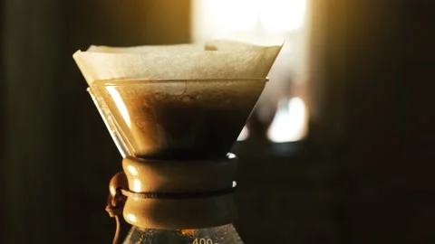 Process of making drip coffee. Brewed coffee dripping in glass coffee pot Stock Footage 141499284