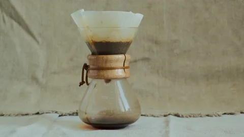 Process of making drip coffee. Pouring coffee drops close up morning beverage Stock Footage 140205243