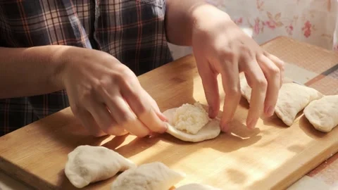 Process of making dumplings. Closeup of preparing traditional dish Stock Footage 140207696