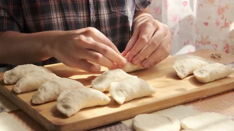 Process of making dumplings side view. Closeup of preparing traditional dish Stock Footage 140208490