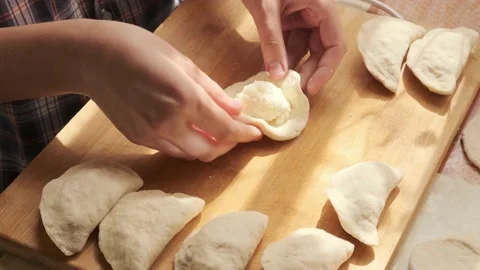 Process of making dumplings top view. Closeup of preparing traditional dish Stock Footage 140208485