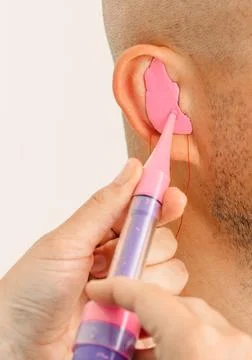 Process of making earplug from an impression of an individual s human ear. Ea 写真素材