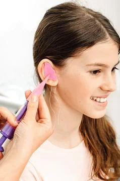 Process of making earplugs from an impression of an individual s child ear. E Photos