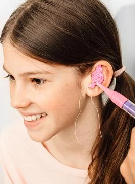 Process of making earplugs from an impression of an individual s child ear. E Fotos Stock