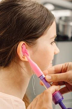 Process of making earplugs from an impression of an individual s child ear. E Stock-Fotos