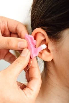 Process of making earplugs from an impression of an individual child ear. Ear 库存照片