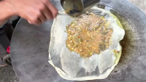The process of making egg 'martabak' or Motabbaq Stock Footage 202265610